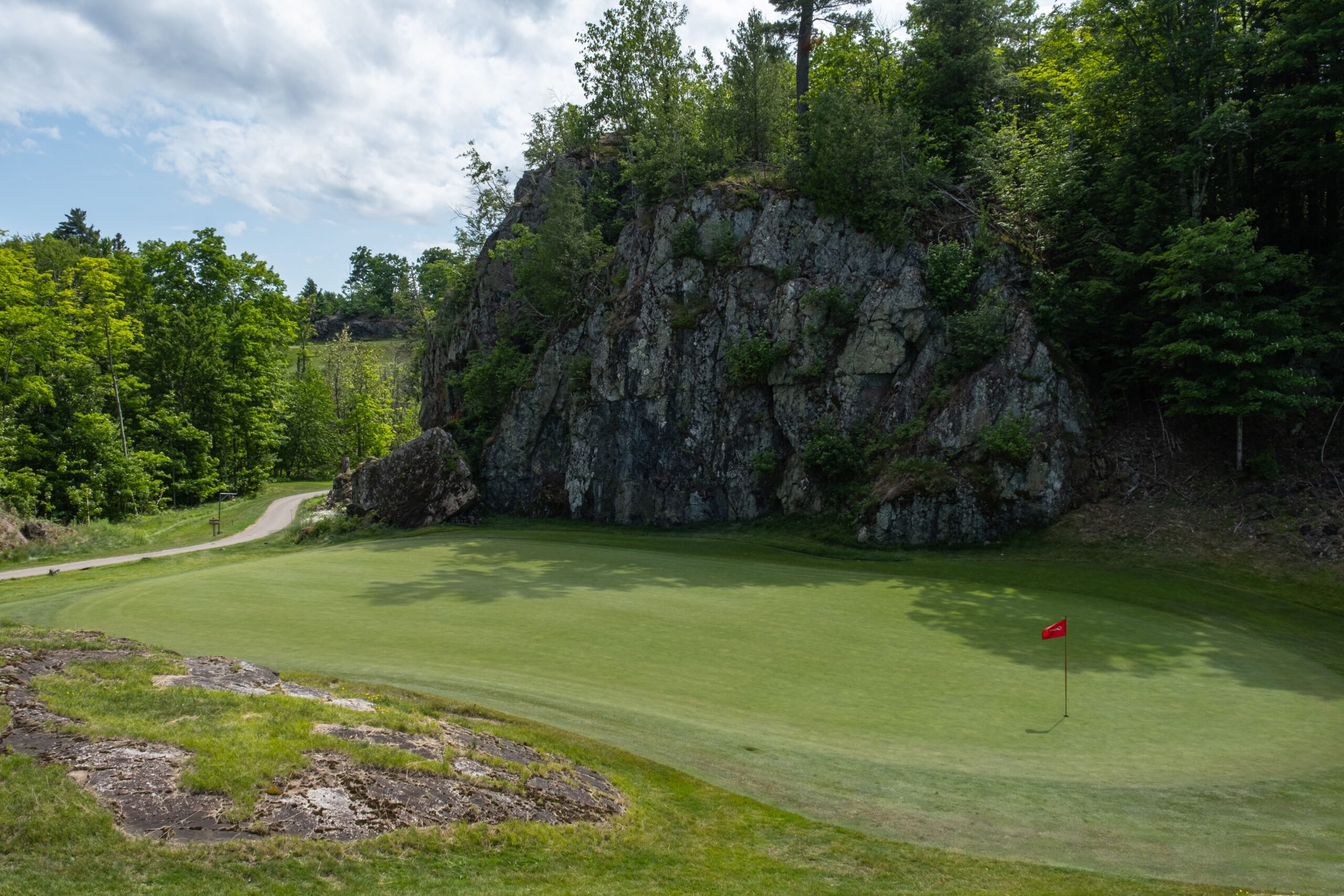 Greywalls routed through exposed granite at Marquette Golf Club